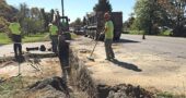 Last week the Village-contracted GM Pipeline crew severed the roadway between Xenia Avenue and Allen Street to replace a 20-foot section of water main with a 12-inch pipe (using GM-contracted local police officers to direct traffic down to one lane). (Photo by Lauren Heaton)