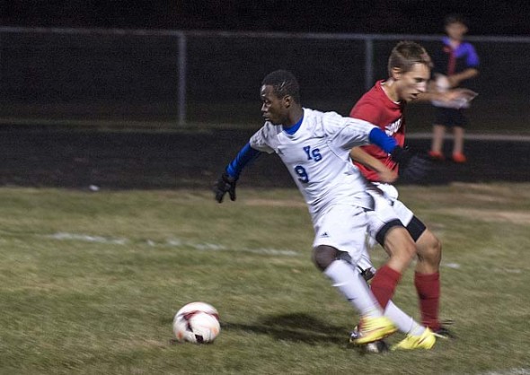 Levi Jackson won the ball from a Twin Valley South player on the way to the Bulldogs’ 7–0 home victory over the West Alexandria team in the first round of Div. III sectional tournament play on Wednesday, Oct. 21.  (photo by Aaron Zaremsky)