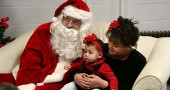 Alyssa and Aaliyah (who wasn't to sure about the man next to her) Worley got their picture taken with Santa last Saturday at the Annual Pancake Breakfast at the United Methodist Church. (Photo by Suzanne Szempruch)