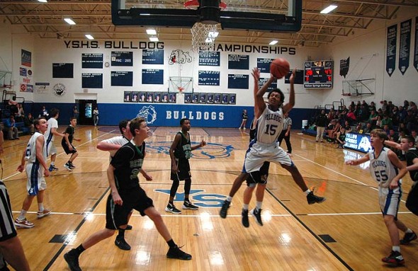 YSHS JV Bulldog #15 Tyrese Benning went airborne to take a shot against the Bethel Bees last Saturday. The JV, Varsity and Lady Bulldogs played consecutive games against the Bees at home on Dec. 19. (Photo by Dylan Taylor-Lehman)