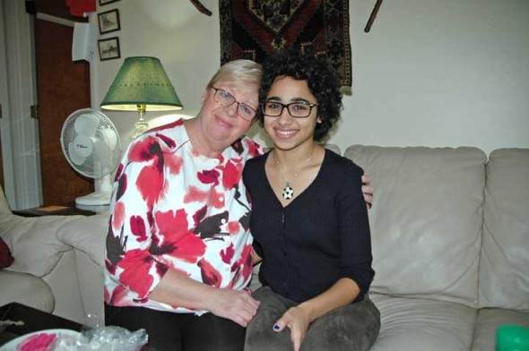 Antioch College student Jumana Snow and her mother, Susan, in their home. Mother and daughter moved to Yellow Springs from Jeddah, Saudi Arabia, in 2014 for Jumana to attend college. Coming here was a sort of homecoming for Susan, who grew up in the United States (in Vermont), but has lived in Saudi Arabia for 28 years. This is Jumana’s first time living outside the Middle East. (photo by Audrey Hackett)
