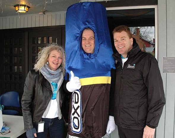 YSI/Xylem employees in Yellow Springs recently did a “Walk for Water” from the YSI campus to the Little Art Theatre to raise funds for Xylem’s global water philanthropy. From left, local YSI/Xylem employee Anita Brown, employee Tim Benson (in costume) and Colin Sabol, president of Xylem Analytics and Treatment. (Photo by Audrey Hackett)