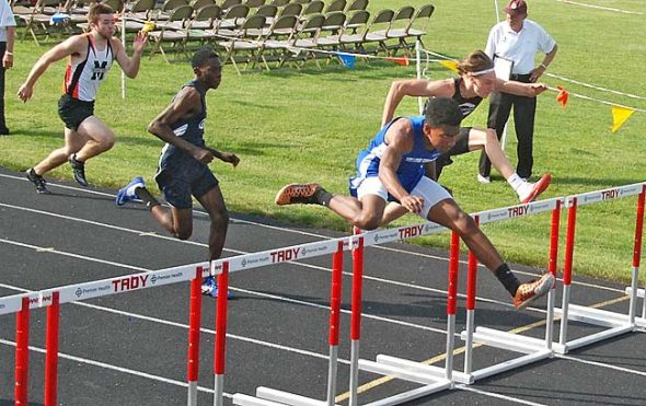 Kaner Butler hurdles to a second-place finish in the 110 hurdles during  the regional meet held in Troy last week. Both Okia and Butler, along with Julie Roberts advanced to the state track meet this weekend in Columbus. (Submitted photo)