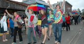 The fifth annual YS Pride Celebration will take place downtown on Saturday, June 25. The day will be packed full of events, such as live music, guest speakers and an interfaith service of affirmation. Dayton-area drag performers, The Rubi Girls, will perform at Peach’s. Shown above are revelers from last year’s Pride parade, marching proudly in the rain. (News Archive Photo by Diane Chiddister)