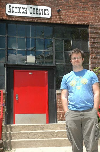 Pianist Sam Reich stands in front of the Antioch College’s Foundry ­Theater, which houses the college’s Steinway concert grand piano. Reich hopes to fund the restoration of the piano to peak form through the proceeds of the Yellow Springs Piano Fest, a series of performances he envisons over the next year. Reich will kick off the series with a performance of J.S. Bach’s Goldberg Variations, Sunday, July 24, at 7 p.m. at the Herndon Gallery. (Photo by Carol Simmons)