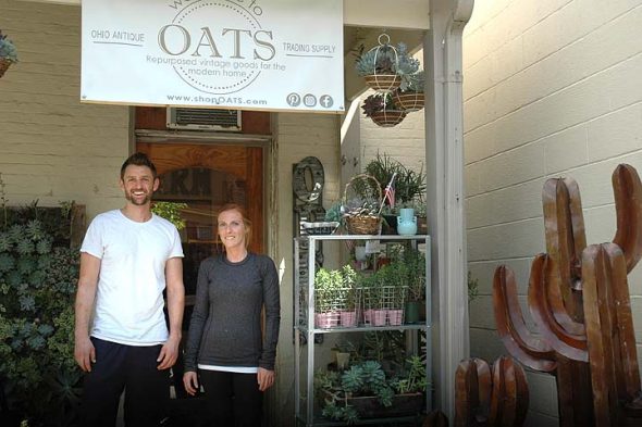 Sam Jacobs and shop owner, Abbey Knight stand in front the newest store downtown, OATS, Ohio Antique Trading Supply. (Photo by Carol Simmons)