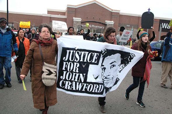 From left, Yellow Springs residents John and Maria Booth and Liz Porter were among the participants in Black Lives Matter protests at the Beavercreek Walmart in December 2014, following the police shooting death of John Crawford III in August. (News Archive photo by Diane Chiddister)