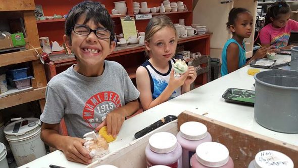 Pictured above. from left, are Ethan Goodman, Devon Townsend, Alicia Lindsay and Evelyn Gauden, glazing their fragile pinch pot-inspired shakers and imagining what the glaze will look like after firing. (Photo submitted by Karly Strukamp)