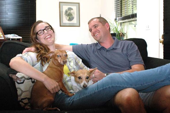 Dorothy Dean and Jarod Rogers moved to Yellow Springs in July of 2015, seeking to be closer to Rogers’ eight-year-old daughters, who live with their mother in Columbus. The couple are enjoying the trees and casual feeling in the neighborhood of their new home, where they relaxed with their dogs Sita and Dicey on a recent weekend. (Photo by Audrey Hackett)
