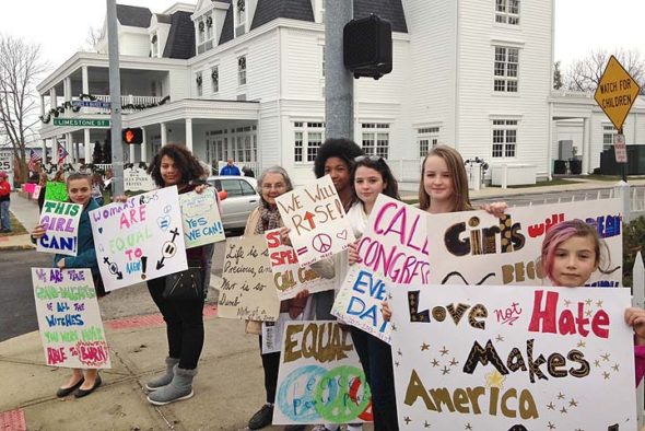 The Yellow Springs Sister March drew at least 250 villagers on Saturday, many expressing positive, pro-women messages, some of them playful. The local march was organized by local seventh-graders Carina Basora and Ava Schell. (Submitted photo by Janeal Ravndal)