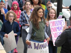 Sister March organizers Carina Basora and Ava Schell, foreground center and right, two McKinney Middle School seventh-graders. (Photo by Matt Minde)