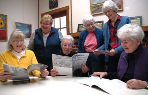 Members of the Senior Center committee putting together “Ripples,” the center’s annual literary journal by and about seniors, are seeking submissions from villagers. Shown above looking at past issues are, from left, Suzanne Patterson, Karen Wolford, Jane Baker, Fran LaSalle, Marianne Whelchel and Lee Huntington. Not pictured is committee member Sandy Love. (Photo by Diane Chiddister)