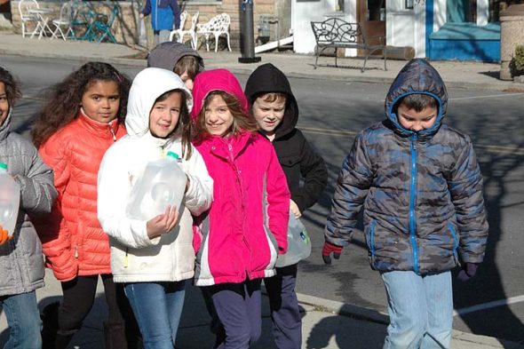 From left, Jaden Douglass, Emery Fodal, Vivian Grushon, Mia Vescio, Alex Hamilton and  Saul Alvarez experience carrying water almost four miles as part of their PBL on water use and accessiblity around the world. (Photo by Robert Hasek)