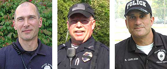 The three candidates who have applied for the position of Yellow Springs chief of police are, from left, officers Dave Meister and Timothy Spradlin, and Interim Chief Brian Carlson. The search was limited to internal candidates. (Left and right: YS News archive photos; center: Submitted)