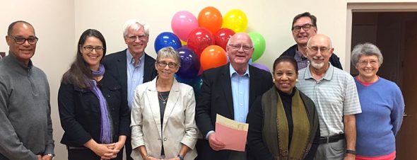 Pictured at the ceremony celebrating 30 years of the Village Mediation Program are mediators John Gudgel, Janet Mueller, Bruce Heckman, Marianne MacQueen, Jalyn Roe, Len Kramer, Staffan Erickson and Jane Scott, with Mayor Foubert. (Submitted photo)