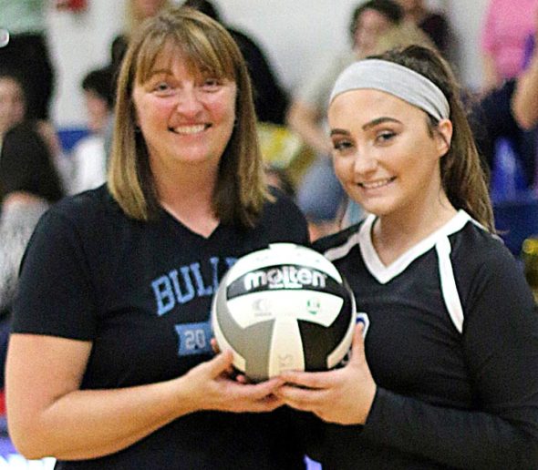 Yellow Springs High School senior Payden Kegley was recently recognized for reaching 1,000 digs during her high school volleyball career. She is pictured here with Coach Christine Linkhart. (Submitted photo)