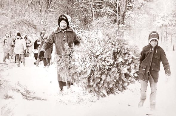 A Yellow Springs News photo from December 1973 shows resident Ethel Bender and her son, Michael, with the Christmas tree they selected at that year’s School Forest Festival. (Photo courtesy of Scott Sanders, Antiochiana)