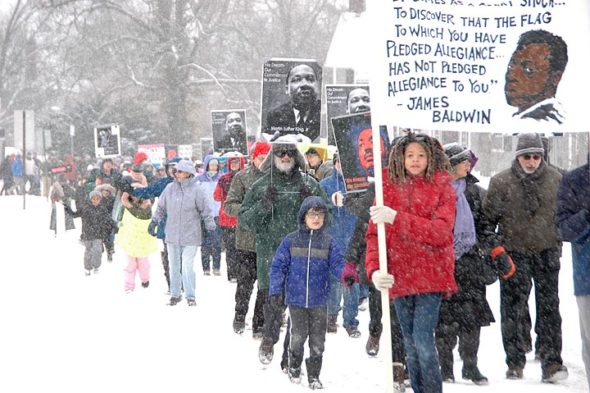 Several hundred villagers showed up in the cold and snow to march and honor Dr. Martin Luther King Jr. (Photo by Matt Minde)