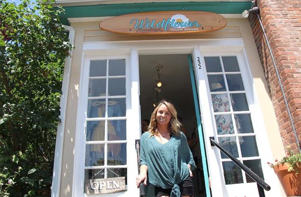 Danyel Mershon, who opened Wildflower Boutique three years ago this weekend, has been plagued by shoplifters at the store. She and other local shop owners are joining together to alert each other when shoplifting occurs. (Photo by Morgan Beard)