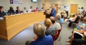 Jeff “Pan” Reich addressed council members during the citizen’s comment period of its July 2 meeting. Reich, along wiht eight other villagers, expressed support for Cpl. David Meister, who is facing disciplinary charges. About 30 citizens attended. (Photo by Megan Bachman)