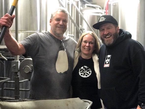 Brewer Jon Vanderglas, Little Art Theatre Executive Director Jenny Cowperthwaite, and Paul Herzog of Yellow Springs Brewery at the recent “brew day” where the White Russian Milk Stout was crafted for the “Big Lebowski” event on Feb. 10. (submitted photo by Lisa Wolters)