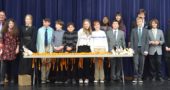 In its second year, the Yellow Springs Debate Team played host to 13 other schools in the first Fearless Forensic Festival, Saturday, Jan. 26. Lined up to present the awards are, from left, coach Brian Housh, and students Eva Vescio, Mackenzie Horton, Conor Anderson, Kian Barker, Miles Gilchrist, Payton Horton, Maggie Wright, Gini Meekin, Solan Palmer, Ashlyn Bailey, Luka Sage-Frabotta, Galen Sieck, Oliver Bahn and Sydney Roberts.