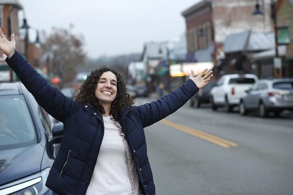 Musician Kyleen Downes on the streets of Yellow Springs, where she frequently performs and also hosts the weekly open mic night at Peach's. Downes will perform at the Yellow Cab Tavern in Dayton on April 14. (Photo by Gary McBride)