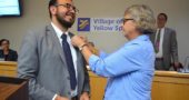 New Village Manager Josue Salmeron was sworn in at Council’s meeting on Monday, June 17. In an impromptu ceremony, outgoing manager Patti Bates went on to fasten Salmeron’s lapel with an official Village of Yellow Springs pin. (Photo by Megan Bachman)