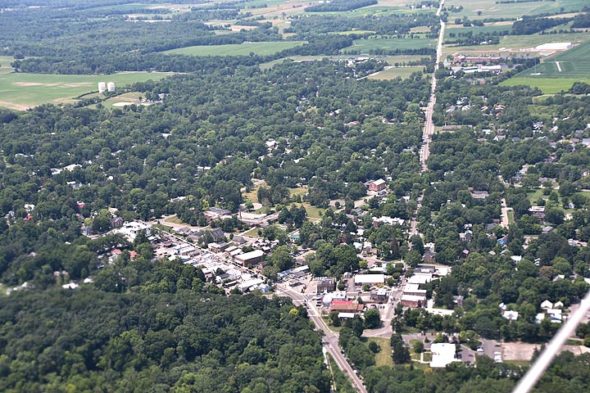 Yellow Springs News freelance photographer Luciana Lieff caught a ride on a biplane at the Springfield Barnstorming Carnival, and risked life and limb — or at least camera — to capture this aerial view of the village. (Photo by Luciana Lieff)