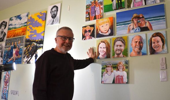 Local artist Tim Potter, shown here in his home studio with his portraits of family members in the background, will show about 50 portraits of villagers at The Winds Café this month and next. An opening reception for the exhibit takes place Sunday, Jan. 27, from 4 to 6 p.m. (Photo by Diane Chiddister)