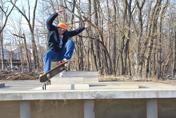 Cameron Rohr, 20, of Springfield, performed a “truck bash” at the Village skatepark on Monday. Despite temperatures in the teens, Rohr slashed and soared with his friends for at least three hours. (Photo by Megan Bachman)