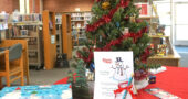 The 2021 Share the Joy holiday tree is now up at the YS Community Library. Requests for gifts will be taken until Sunday, Dec. 5, at 5 p.m. (Photo by Reilly Dixon)
